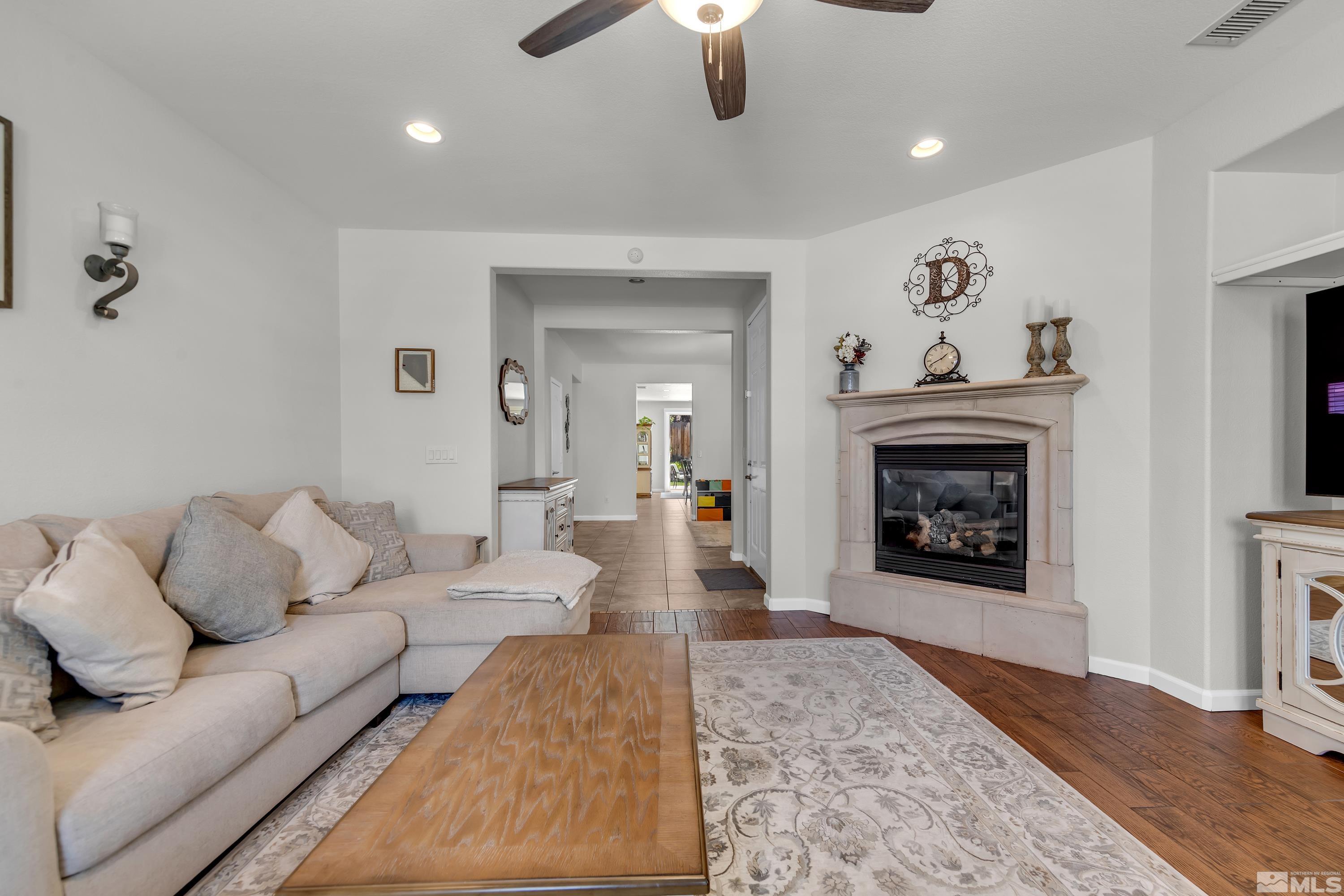 2100 Angel Ridge Drive Reno, NV 89521 - Photo 33 of 35 a living room with furniture and a fireplace