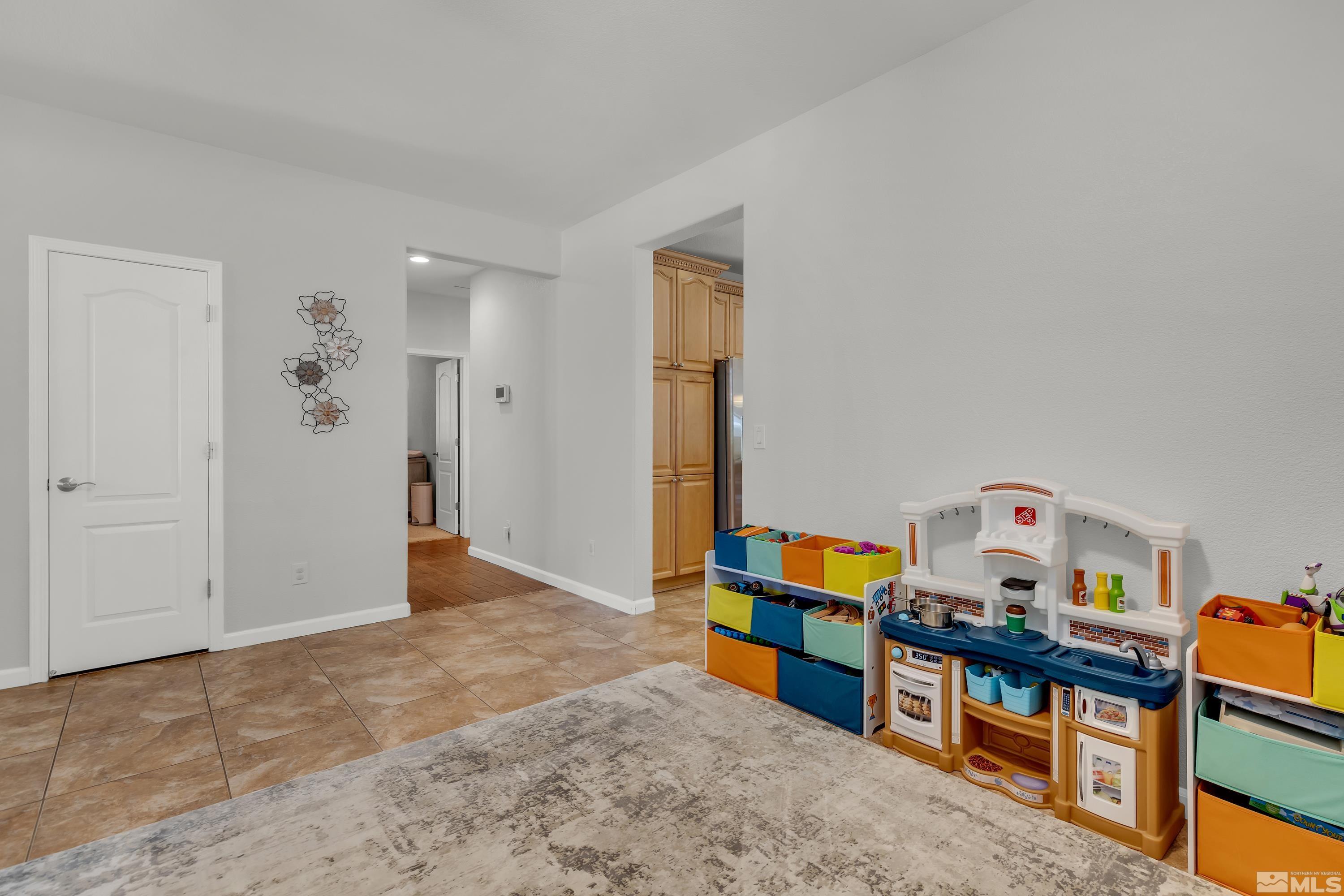 2100 Angel Ridge Drive Reno, NV 89521 - Photo 34 of 35 an empty room with toys and wooden floor