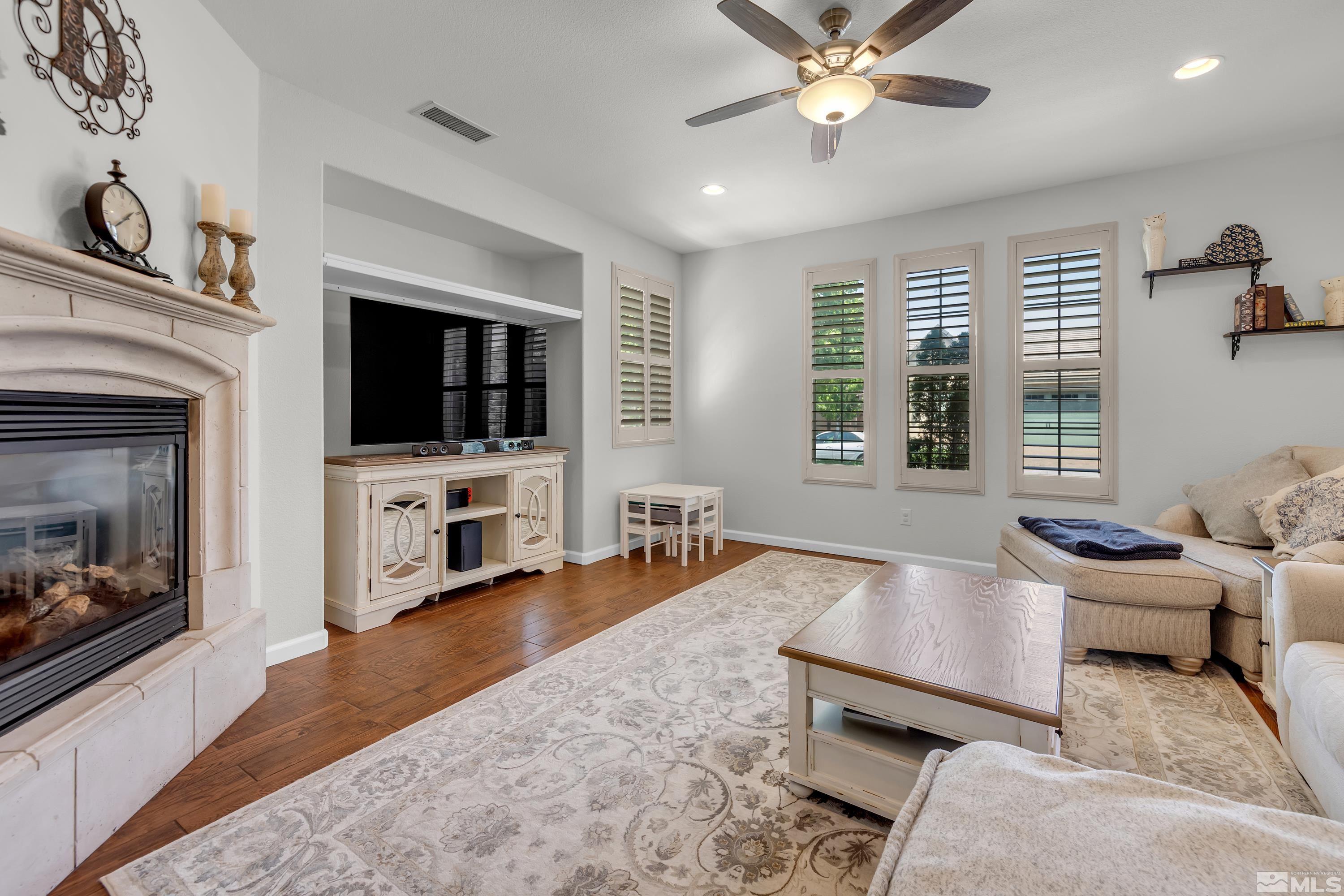 2100 Angel Ridge Drive Reno, NV 89521 - Photo 8 of 35 a living room with furniture and a flat screen tv