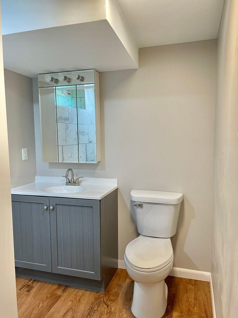 28 South St Road Valparaiso, IN 46385 - Photo 11 of 16 a bathroom with a toilet sink and mirror