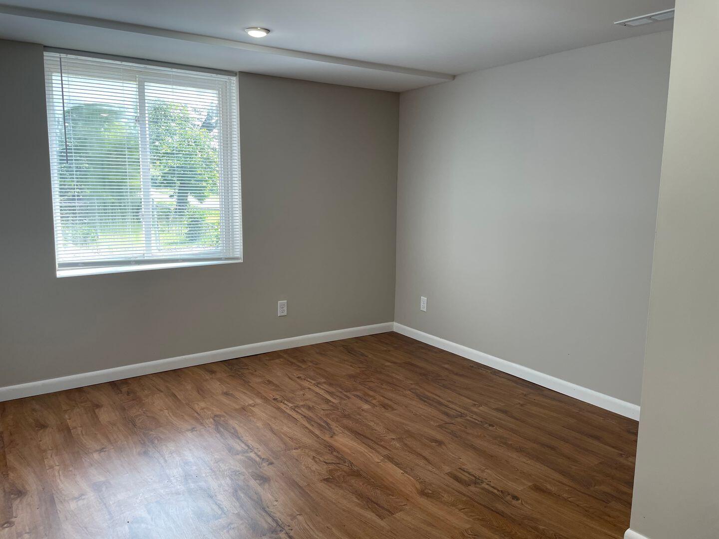 28 South St Road Valparaiso, IN 46385 - Photo 9 of 16 a view of an empty room with wooden floor and a window