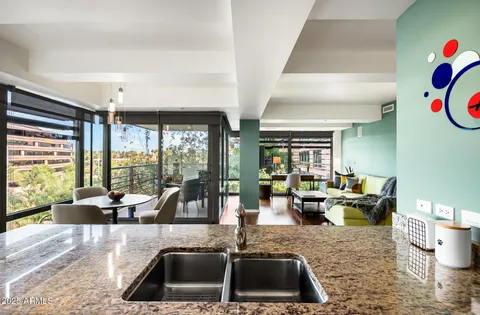 a kitchen with sink refrigerator and window