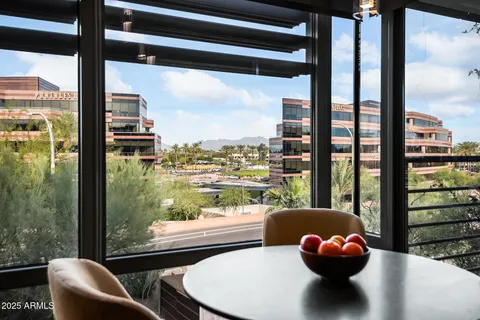 a view of a living room and floor to dining room