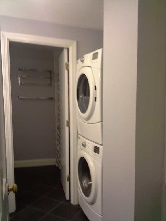 123 Jericho Road, Unit 123 Weston, MA 02493 - Photo 12 of 12 a utility room with dryer and washer