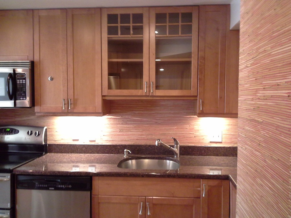 123 Jericho Road, Unit 123 Weston, MA 02493 - Photo 4 of 12 a kitchen with granite countertop a sink and a stove