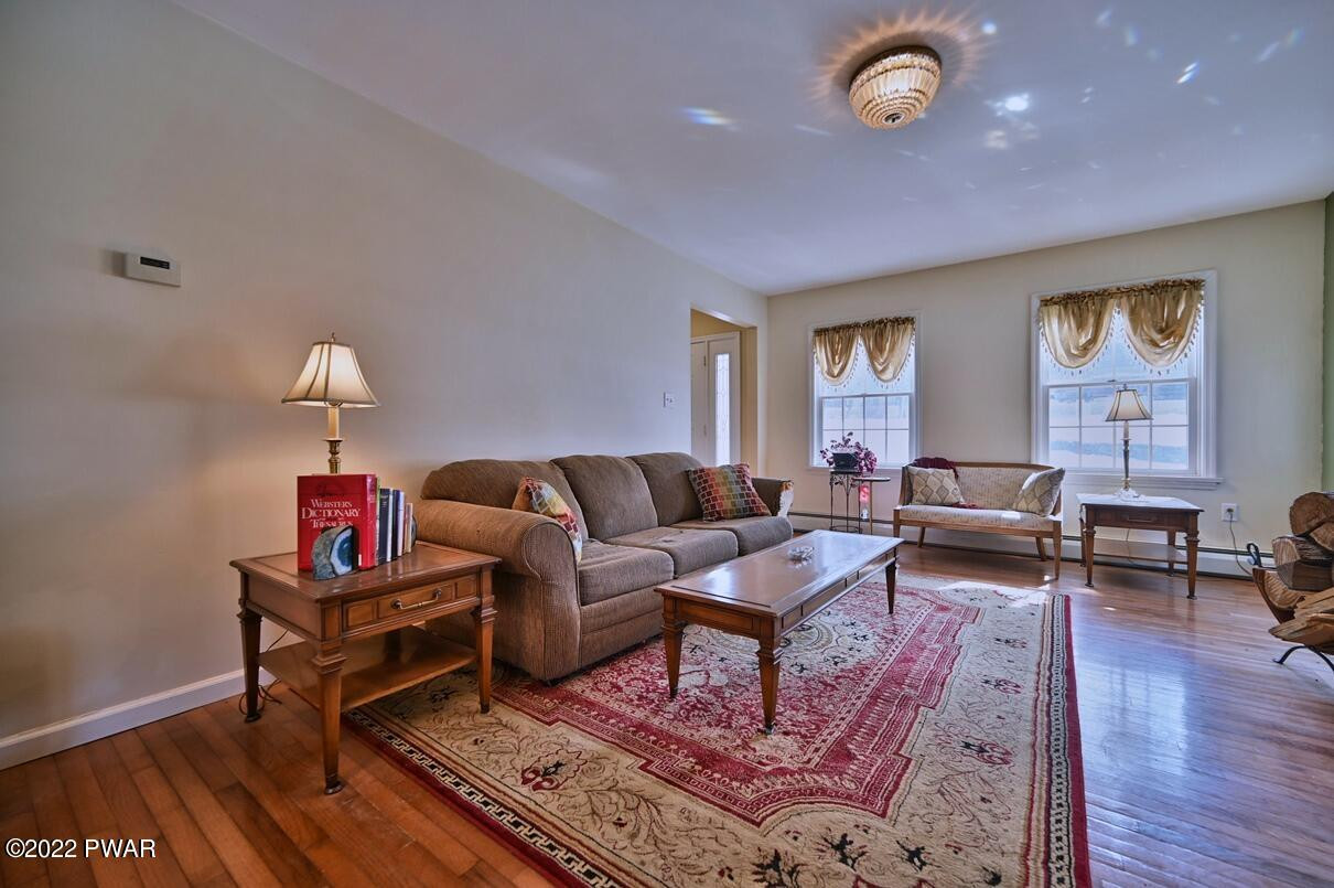 183 Valleyview Road Greentown, PA 18426 - Photo 18 of 110 a living room with furniture and a wooden floor