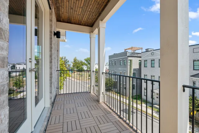 a view of a balcony with wooden floor