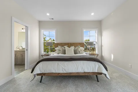 a bedroom with a bed and window