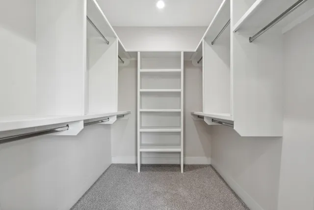 a view of an empty walk in closet