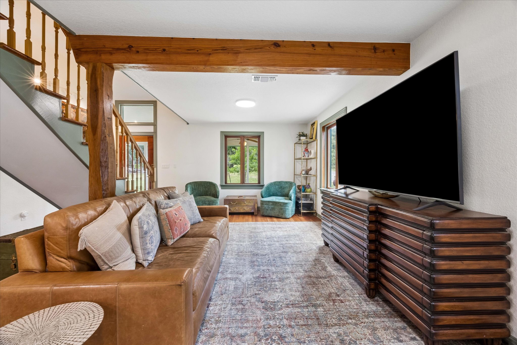 700 South Rainbow Ranch Road Wimberley, TX 78676 - Photo 7 of 29 Exposed wood beams and timeless finishes create warmth throughout