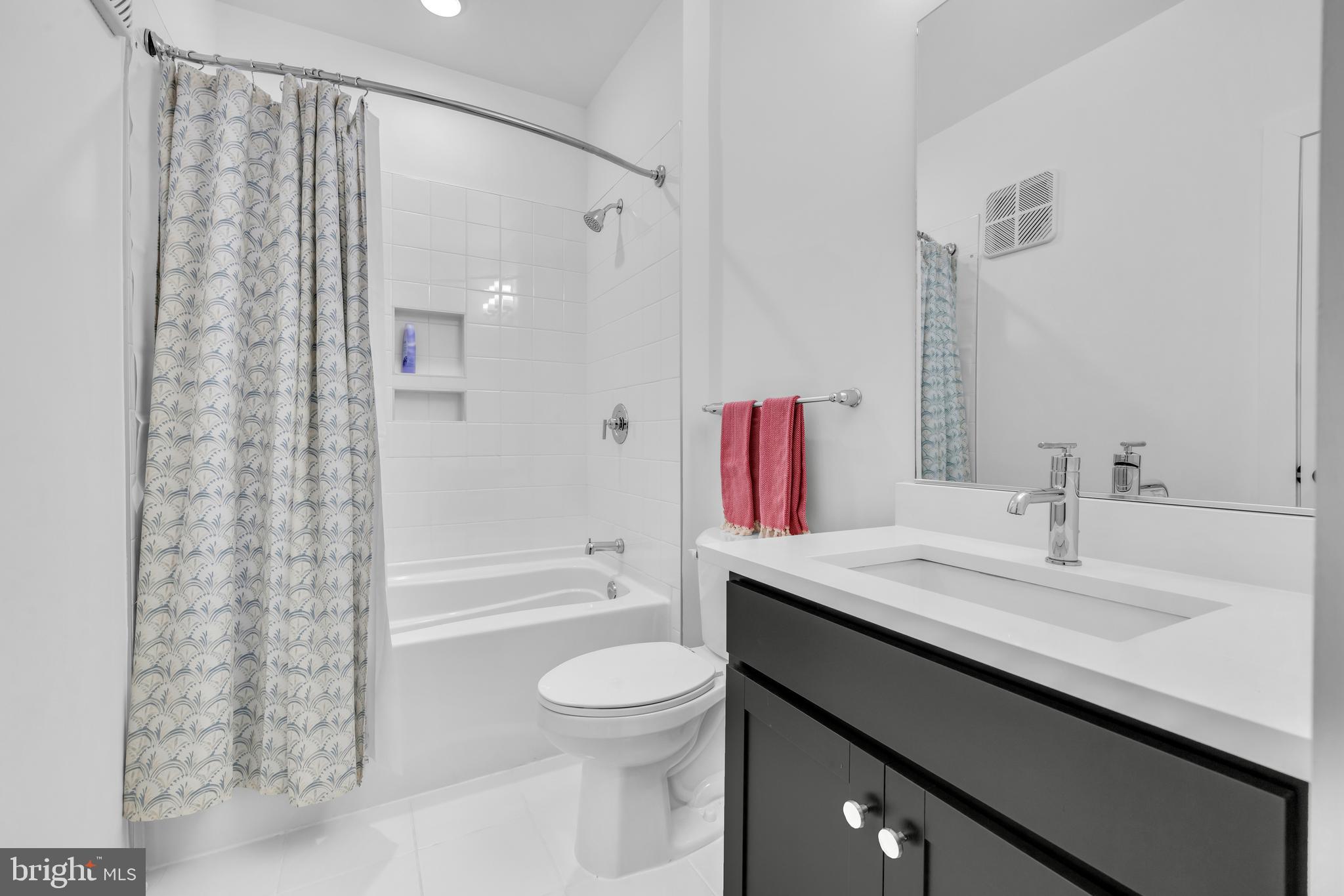 78 Old Mill Bottom Road North, Unit 101 Annapolis, MD 21409 - Photo 16 of 29 a bathroom with a sink a toilet and shower