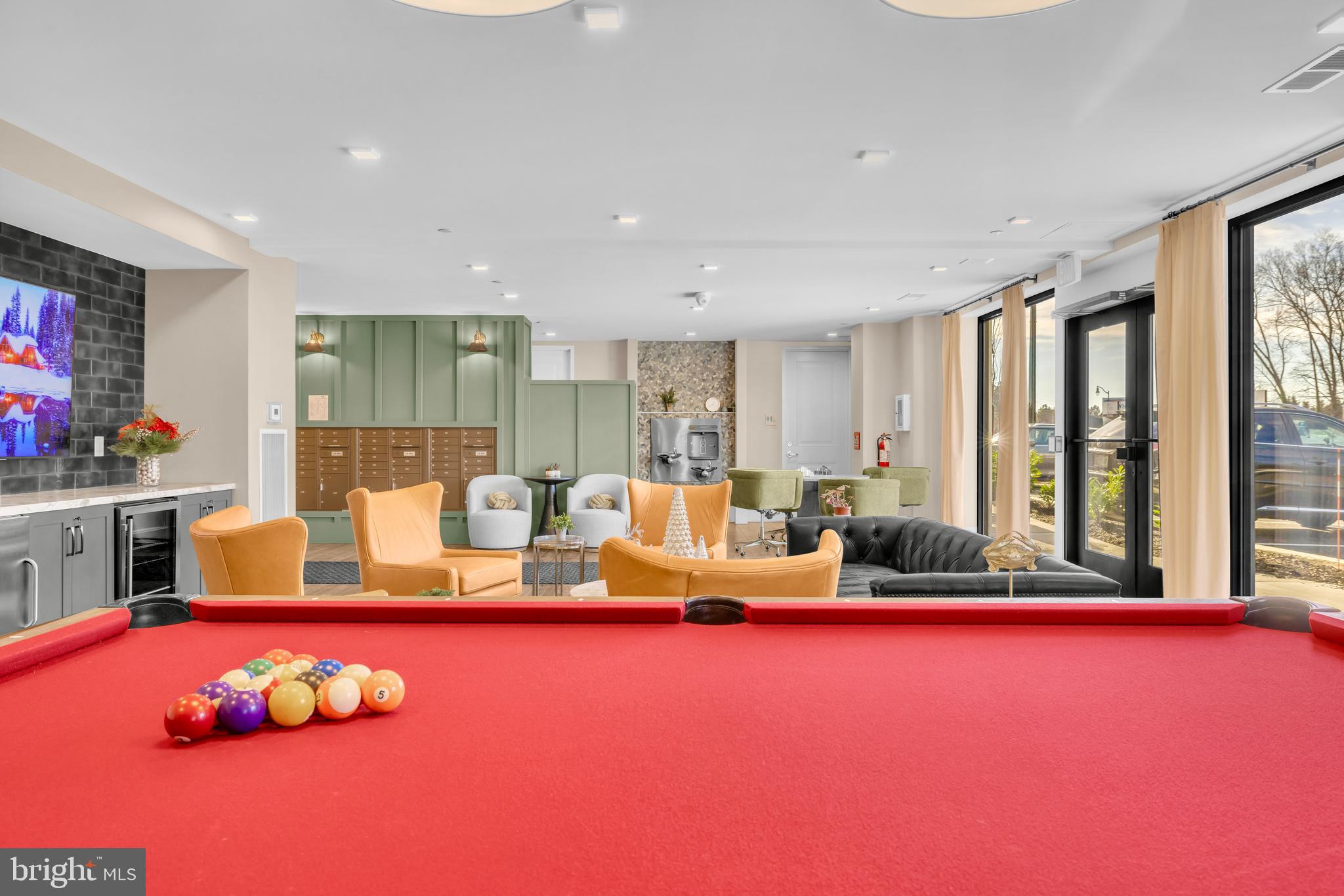 78 Old Mill Bottom Road North, Unit 101 Annapolis, MD 21409 - Photo 19 of 29 a living room with furniture floor to ceiling window and rug floor