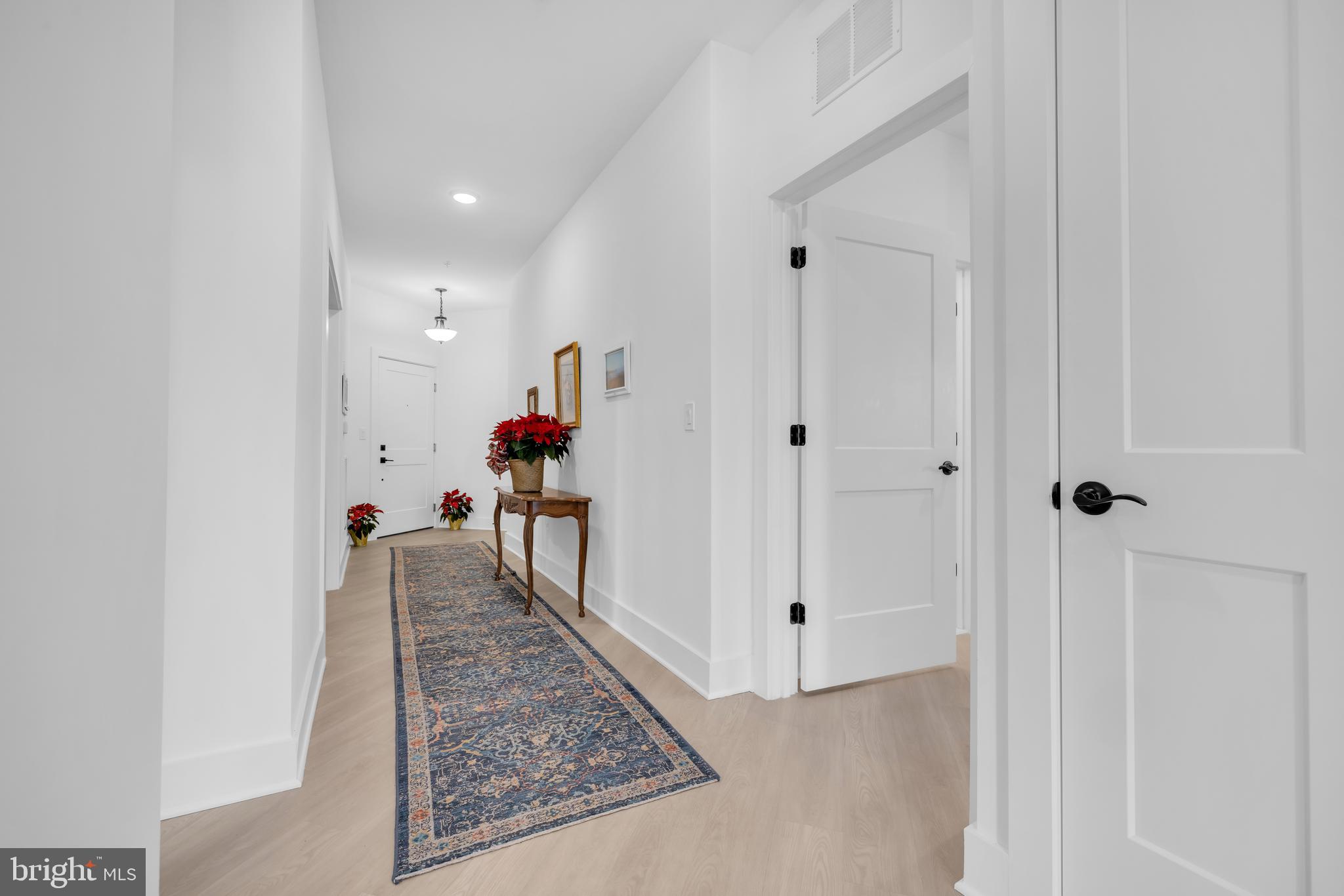 78 Old Mill Bottom Road North, Unit 101 Annapolis, MD 21409 - Photo 4 of 29 a view of a hallway with a dining area