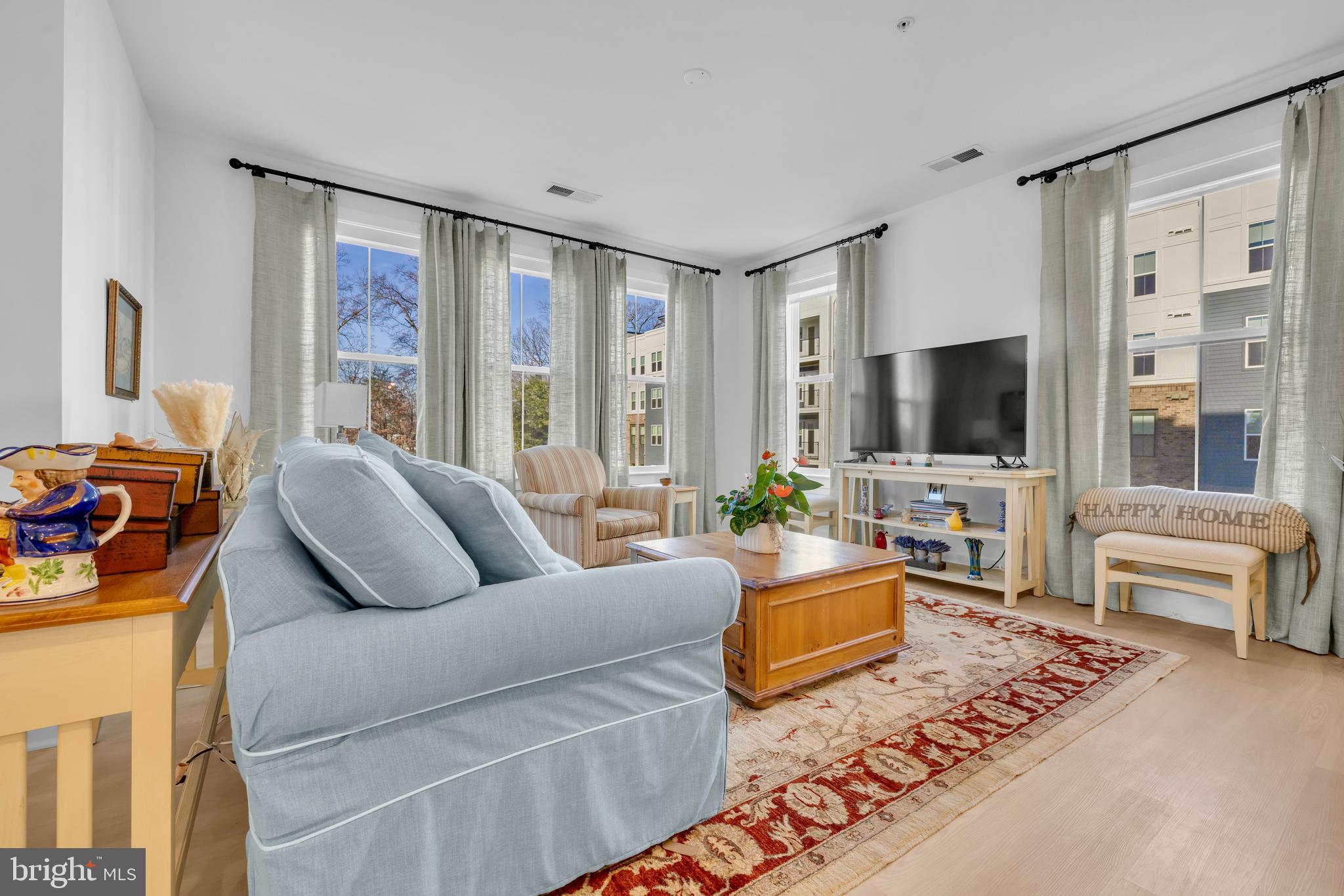 78 Old Mill Bottom Road North, Unit 101 Annapolis, MD 21409 - Photo 7 of 29 a living room with furniture and a flat screen tv