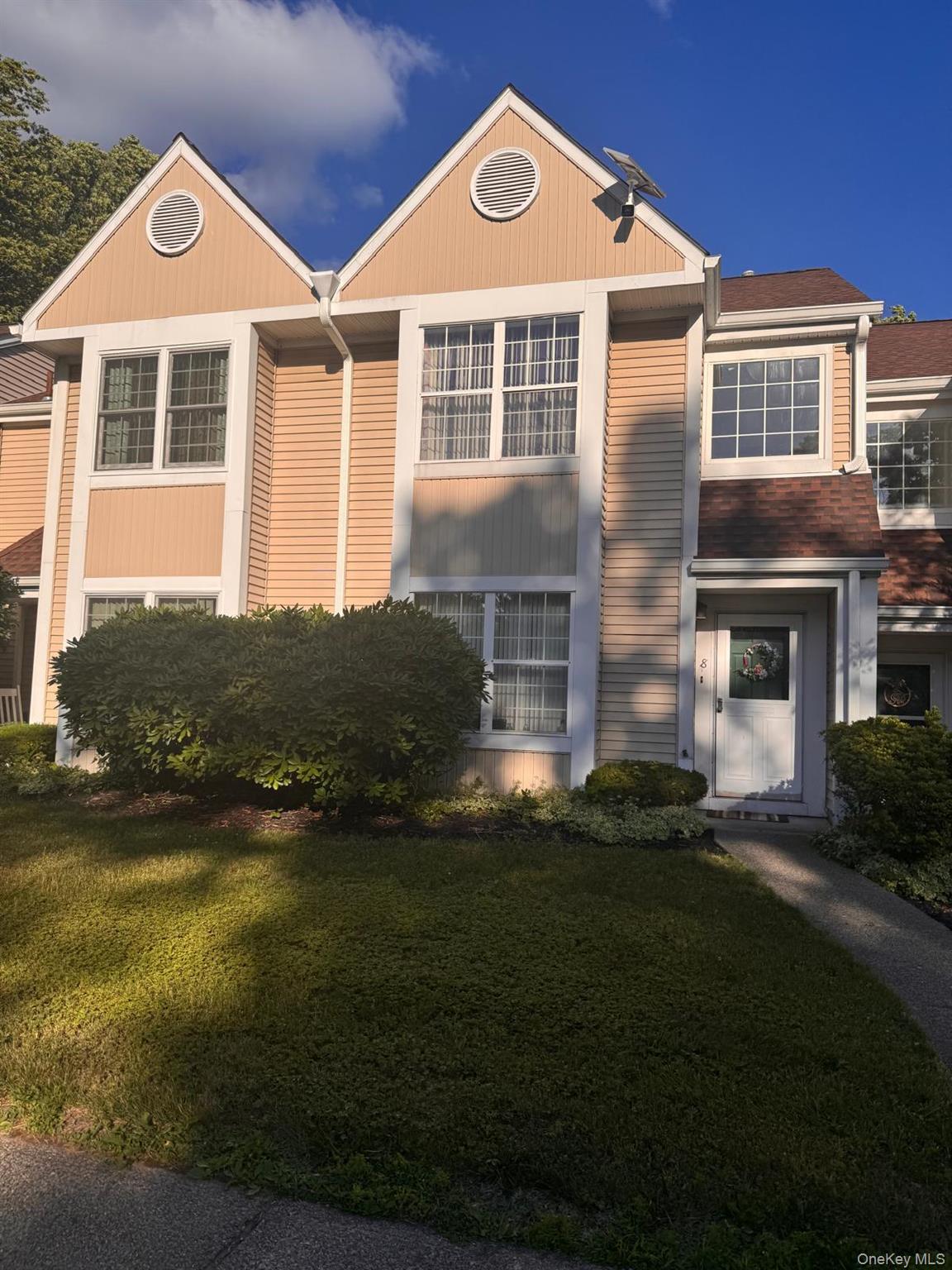 8 Creekside Circle Spring Valley, NY 10977 - Photo 1 of 1 a front view of a house with a yard