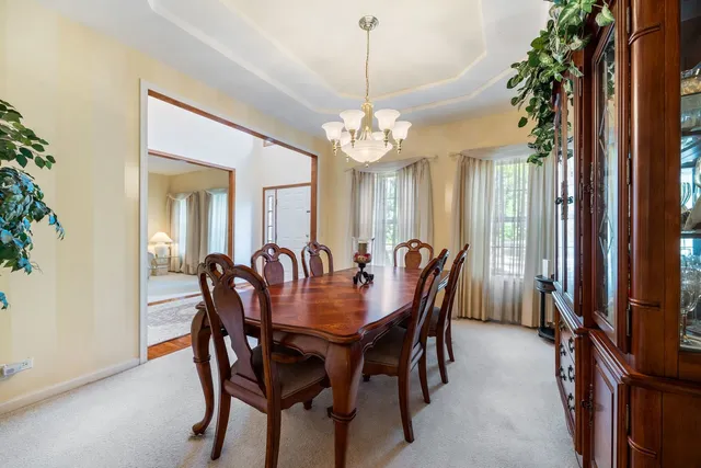a view of a dining room with furniture and window
