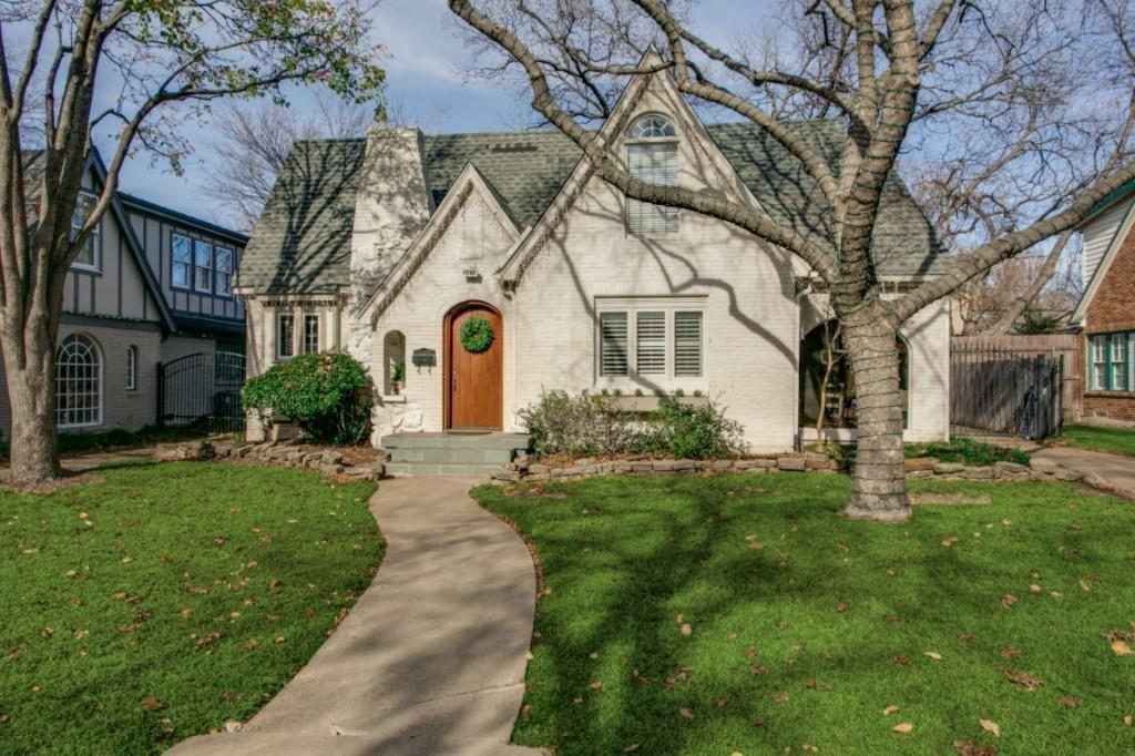5419 Merrimac Avenue Dallas, TX 75206 - Photo 1 of 17 Charming white brick exterior featuring a steep gabled roofline and an arched wooden front door