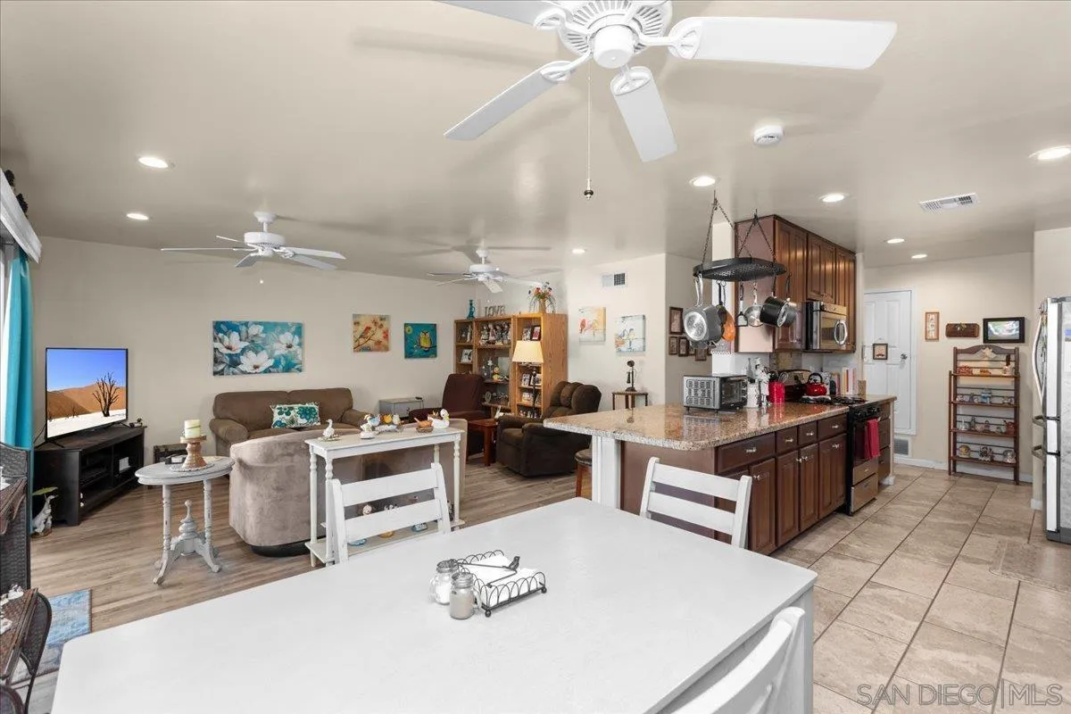9254 Shadow Hill Road Santee, CA 92071 - Photo 11 of 34 a large kitchen with a table and chairs