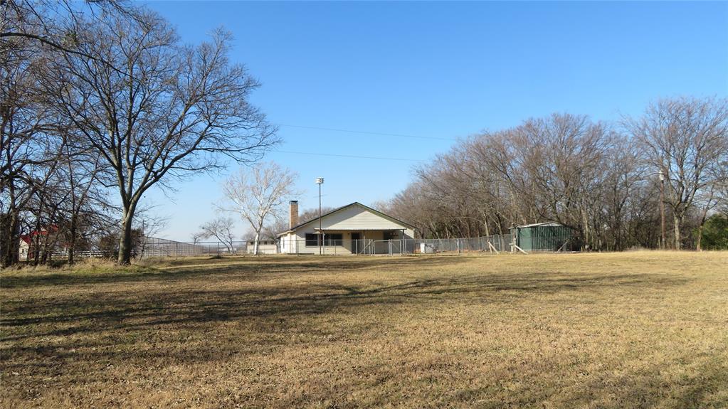 272 Chisam Road Valley View, TX 76272 - Photo 3 of 7 a backyard of house with trees
