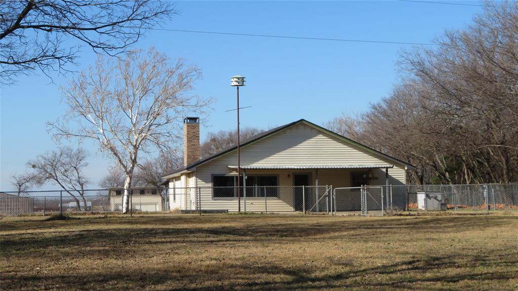 272 Chisam Road Valley View, TX 76272 - Photo 4 of 7 a front view of a house with a yard
