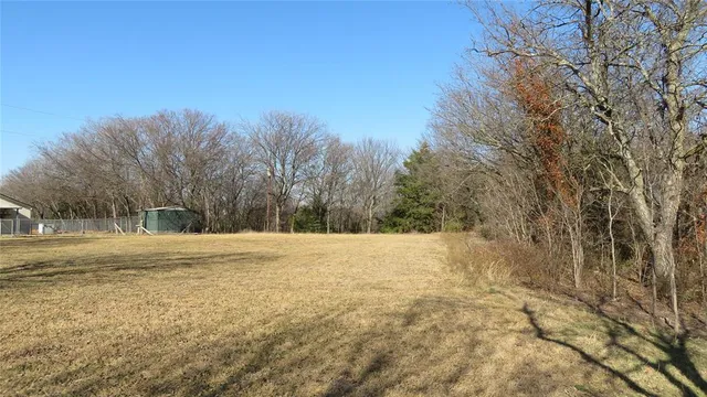 a view of a backyard of the house