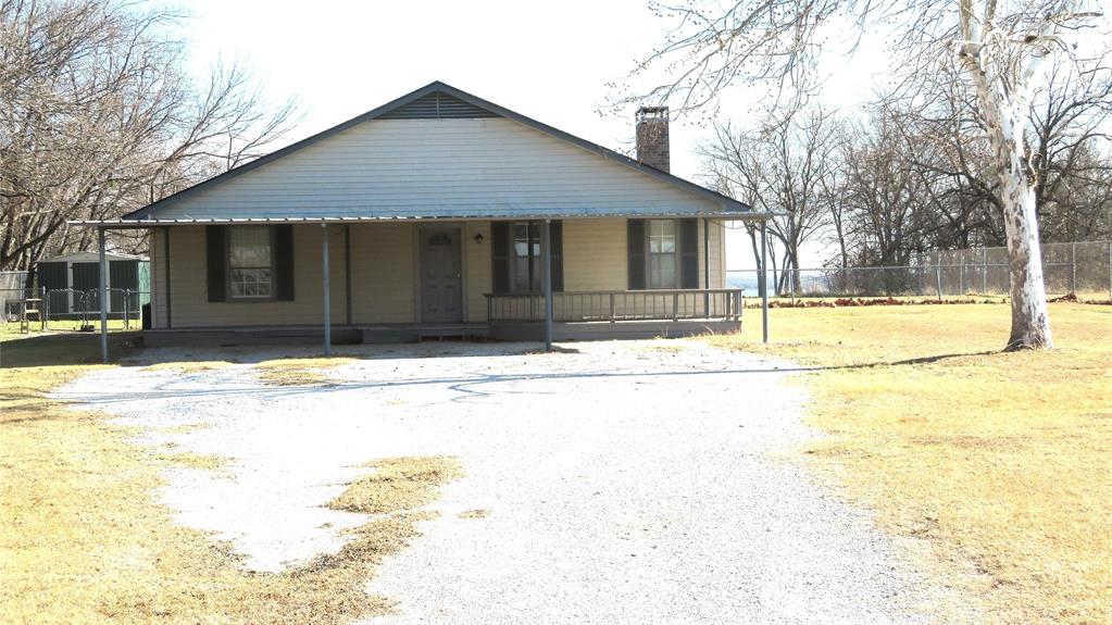 272 Chisam Road Valley View, TX 76272 - Photo 7 of 7 a front view of a house with a yard
