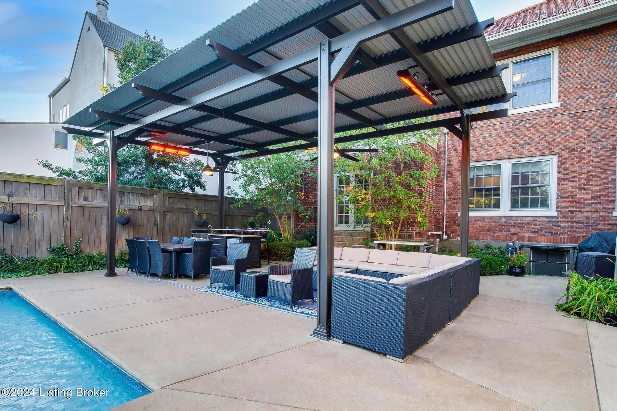 1450 Cherokee Road Louisville, KY 40204 - Photo 6 of 59 Whether hosting a gathering or relaxing alone, this setup adapts to various weather conditions while providing a stylish and functional environment.