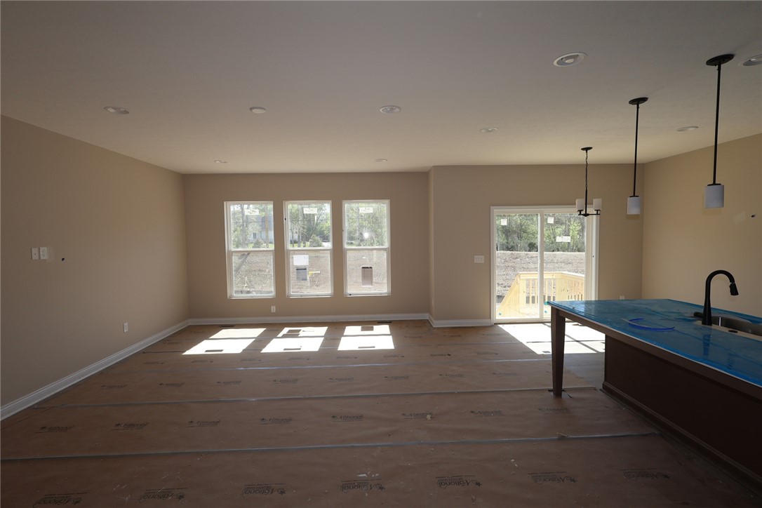 240 Tilly Court, Unit 5 Springboro, OH 45066 - Photo 24 of 26 This bright, open concept living space features large windows and a convenient kitchen island.
