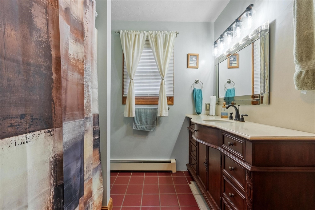 340 Ball Hill Road Princeton, MA 01541 - Photo 28 of 41 a bathroom with a double vanity sink mirror and shower