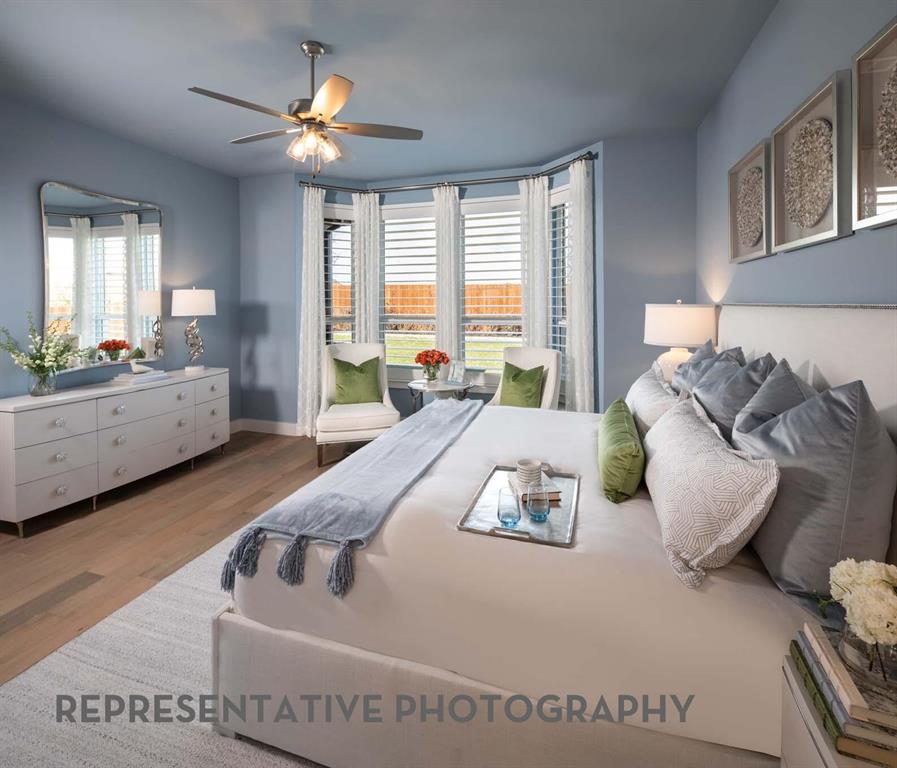8903 Wildberry Road Oak Point, TX 75068 - Photo 12 of 31 a spacious bedroom with a bed and window