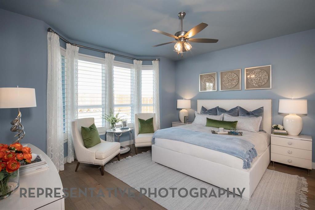 8903 Wildberry Road Oak Point, TX 75068 - Photo 13 of 31 a bedroom with a bed and a large mirror