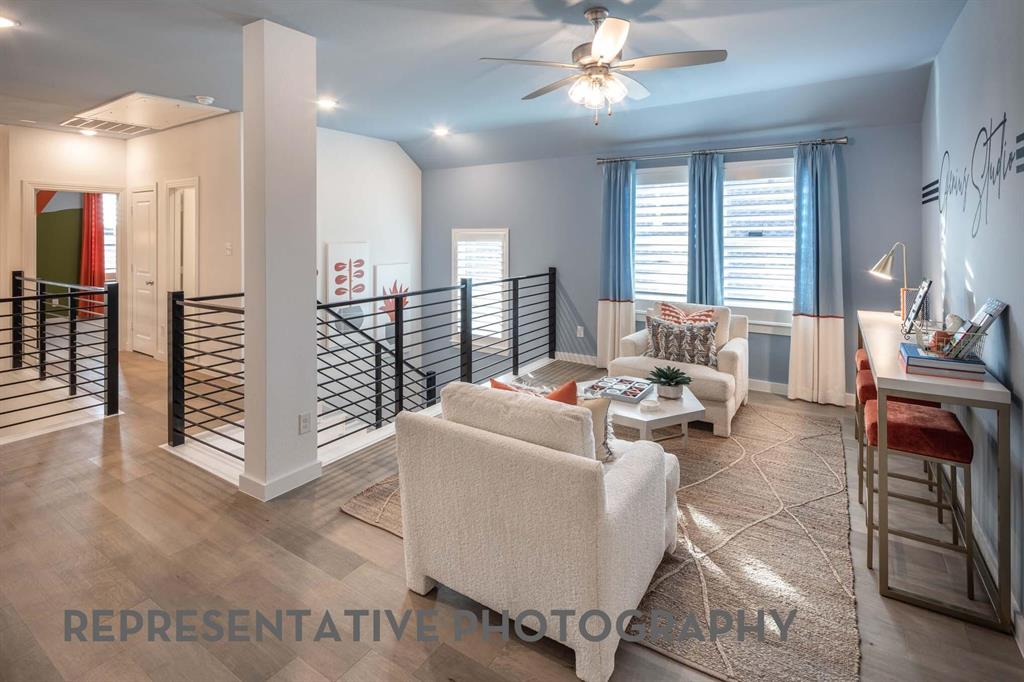 8903 Wildberry Road Oak Point, TX 75068 - Photo 25 of 31 a living room with furniture and a chandelier