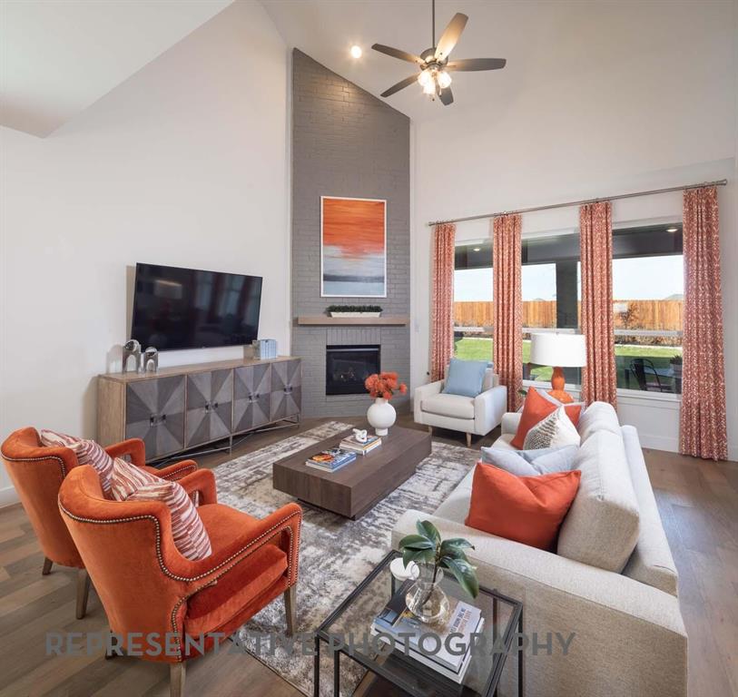 8903 Wildberry Road Oak Point, TX 75068 - Photo 7 of 31 a living room with furniture and a flat screen tv