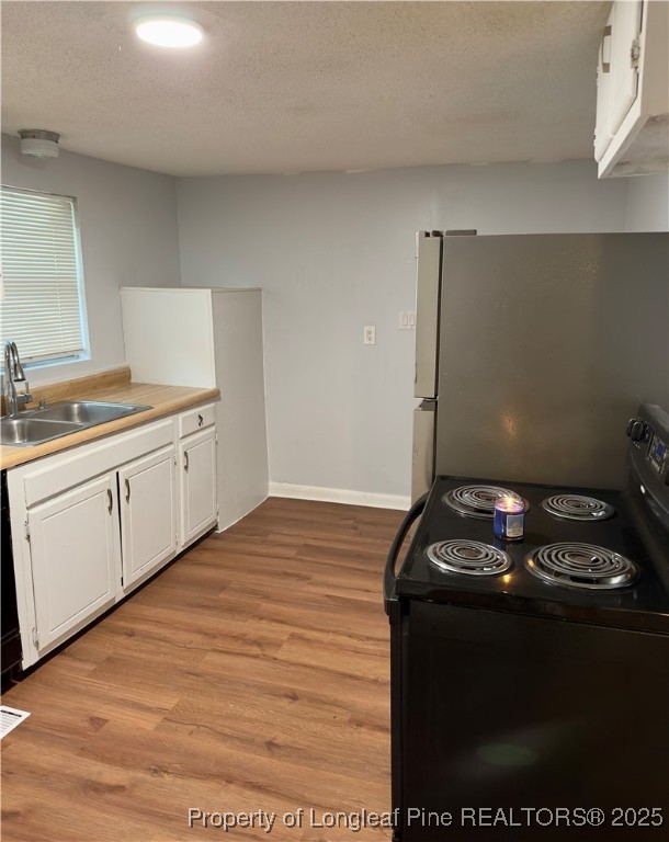 2357 A Watson Lake Road Fayetteville, NC 28306 - Photo 5 of 14 a kitchen with a sink and cabinets