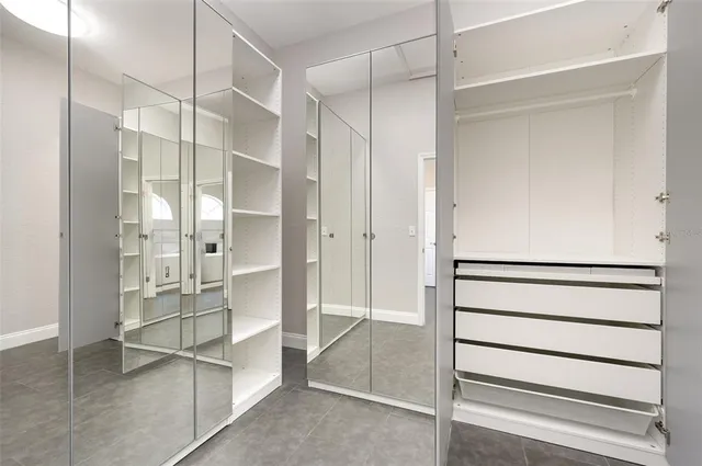 a bathroom with a shower and a glass door