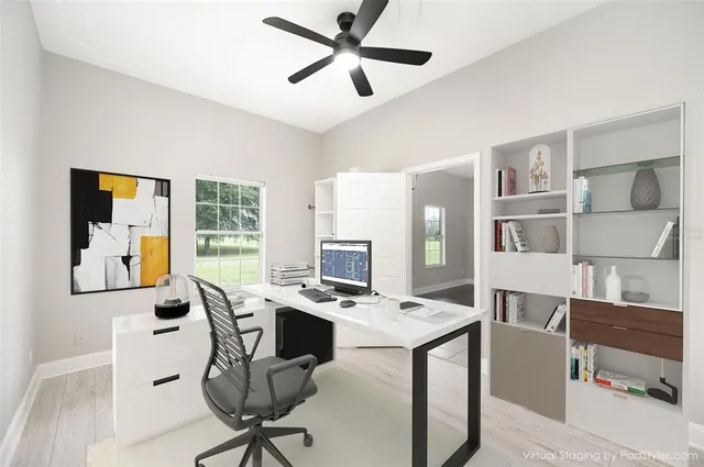 a workspace with furniture and window