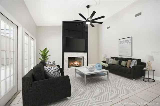 a living room with furniture and a fireplace