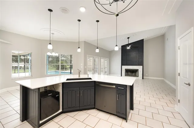 a kitchen with a sink a stove and microwave