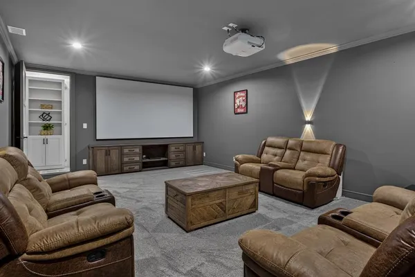 a living room with furniture ceiling fan and a window
