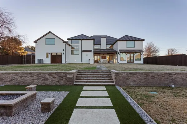 a front view of a house with yard