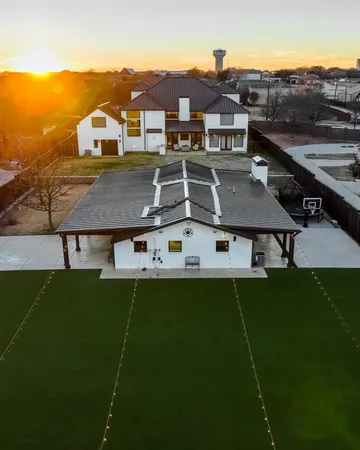 an aerial view of residential house with outdoor space