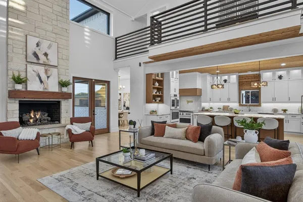 a living room with furniture a rug and a fireplace