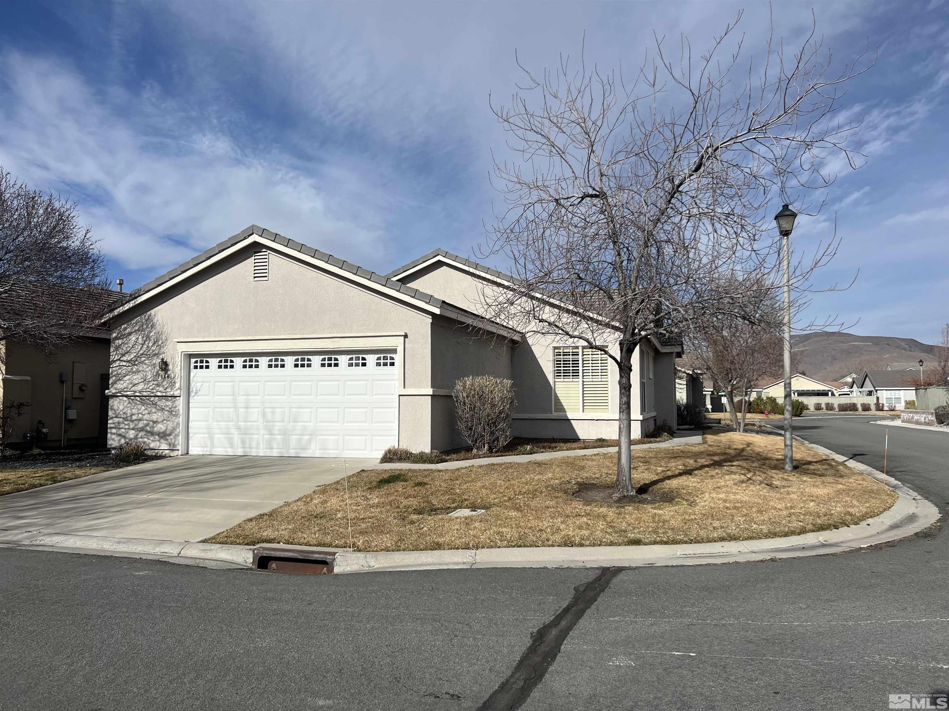 10401 Summershade Lane Reno, NV 89521 - Photo 3 of 3 a view of a house with a snow on the road