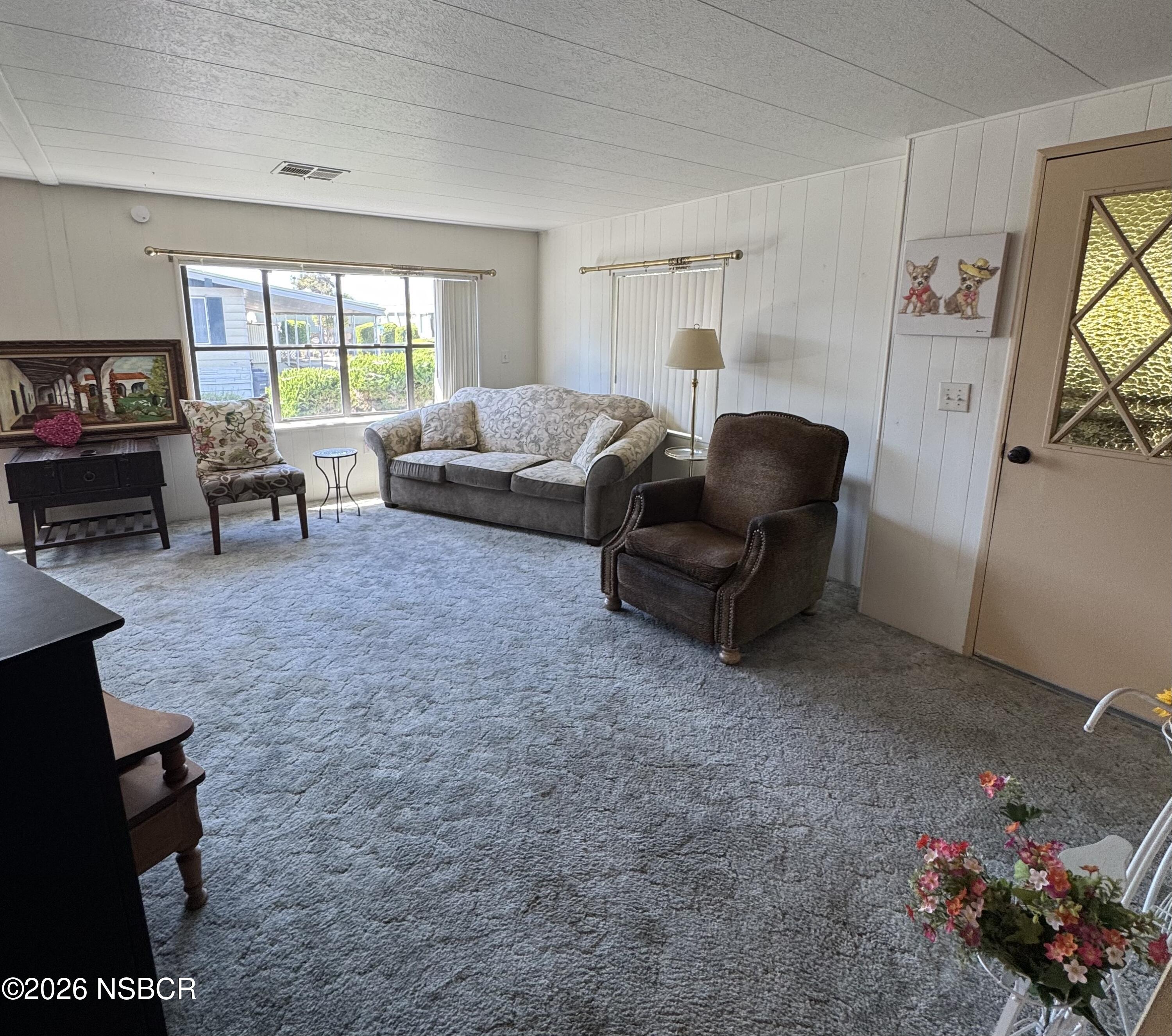 3210 Santa Maria Way, Unit 173 Santa Maria, CA 93455 - Photo 2 of 24 a living room with furniture and a large window