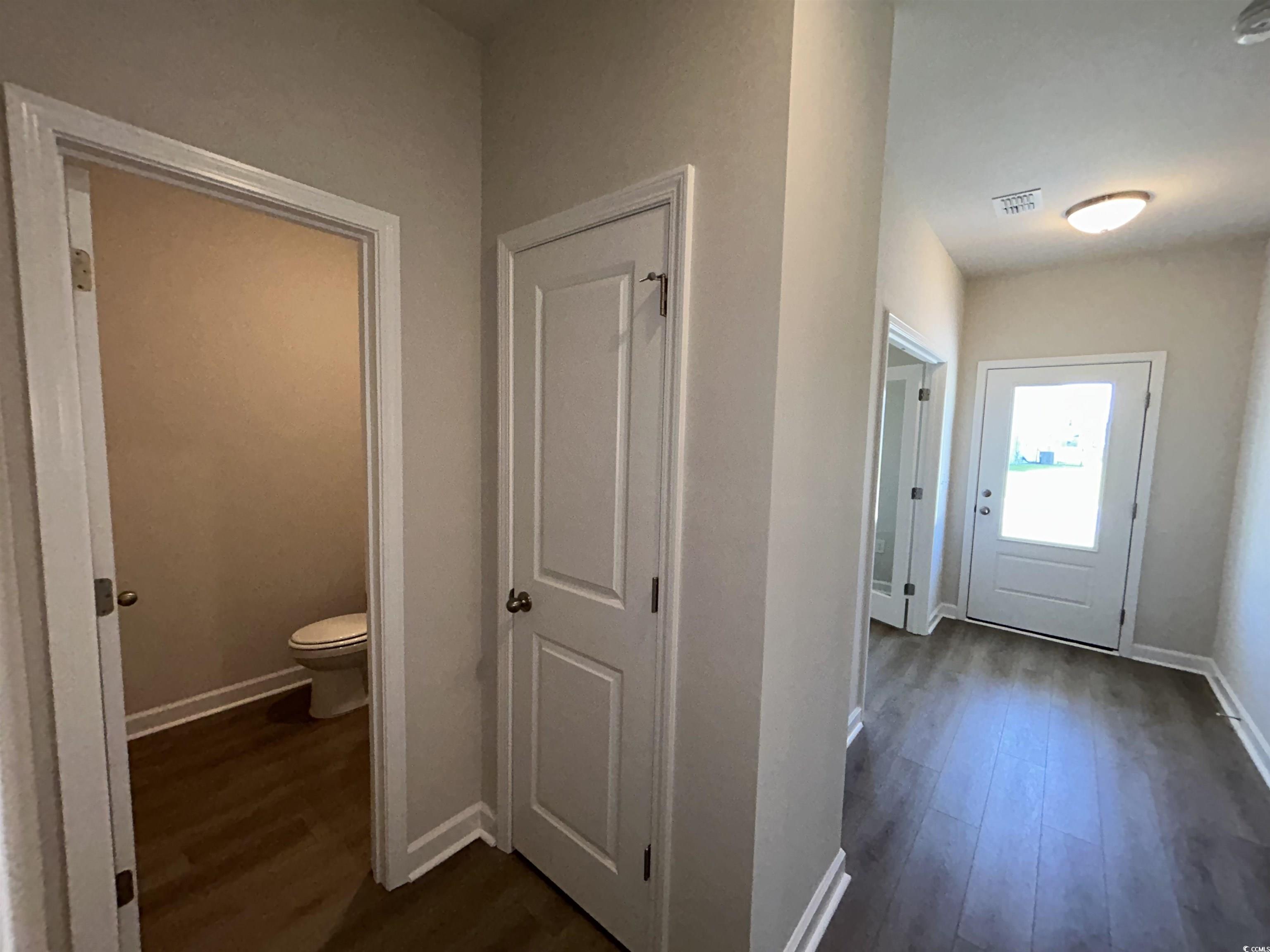 3068 Palma Way Myrtle Beach, SC 29579 - Photo 11 of 30 Hallway featuring dark wood-type flooring