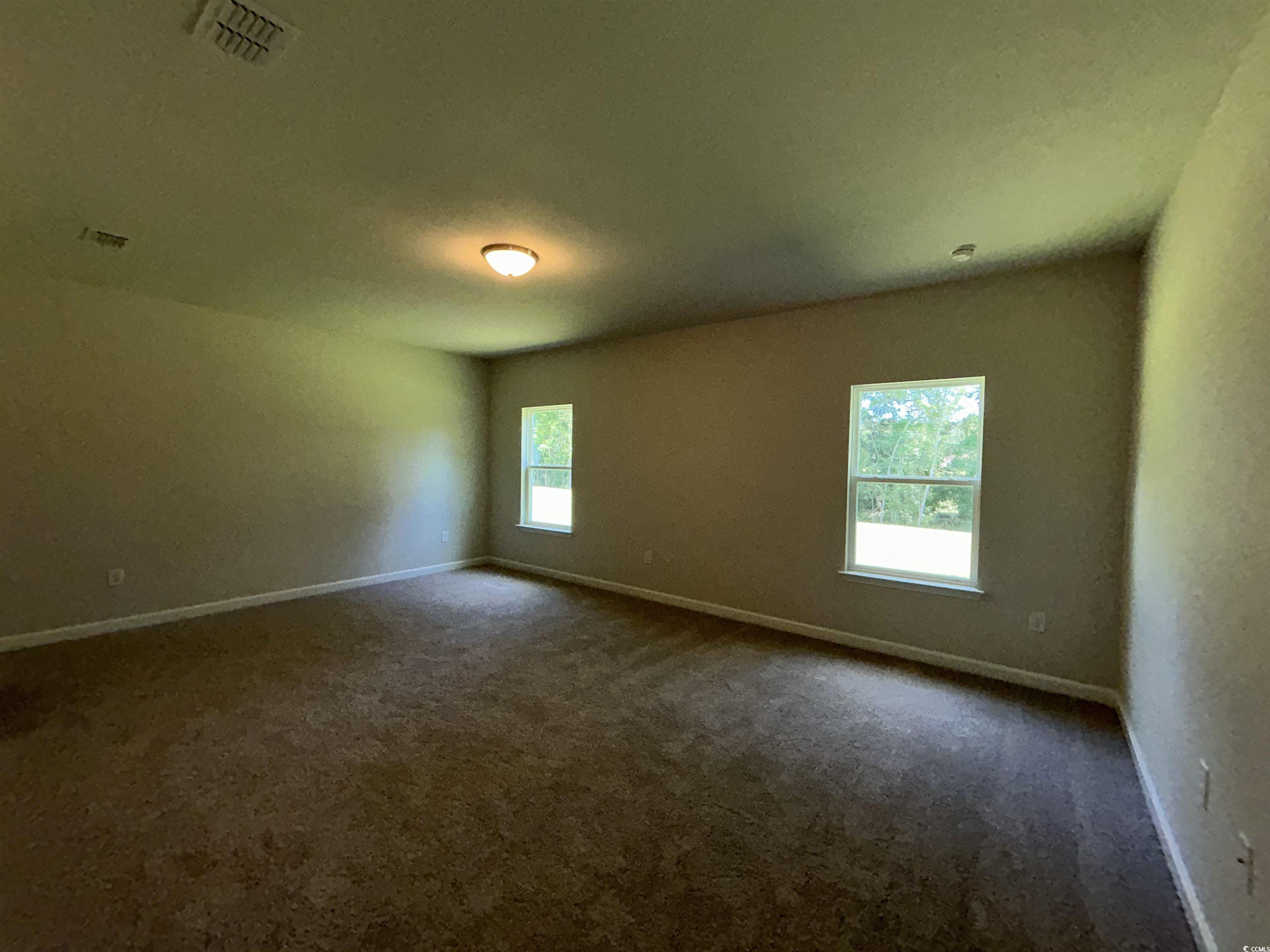 3068 Palma Way Myrtle Beach, SC 29579 - Photo 20 of 30 Spare room featuring dark carpet