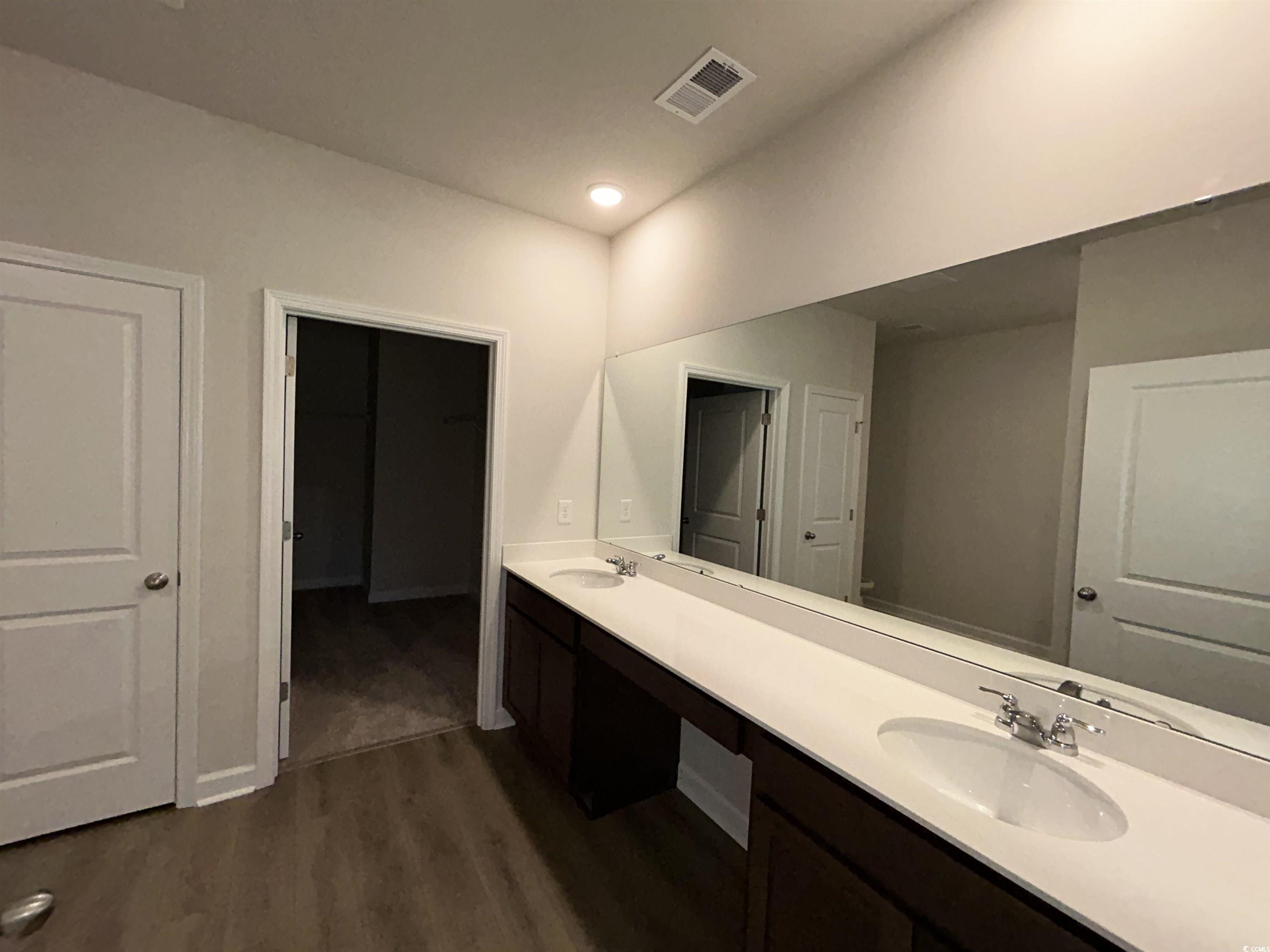 3068 Palma Way Myrtle Beach, SC 29579 - Photo 21 of 30 Full bathroom featuring wood finished floors and double vanity