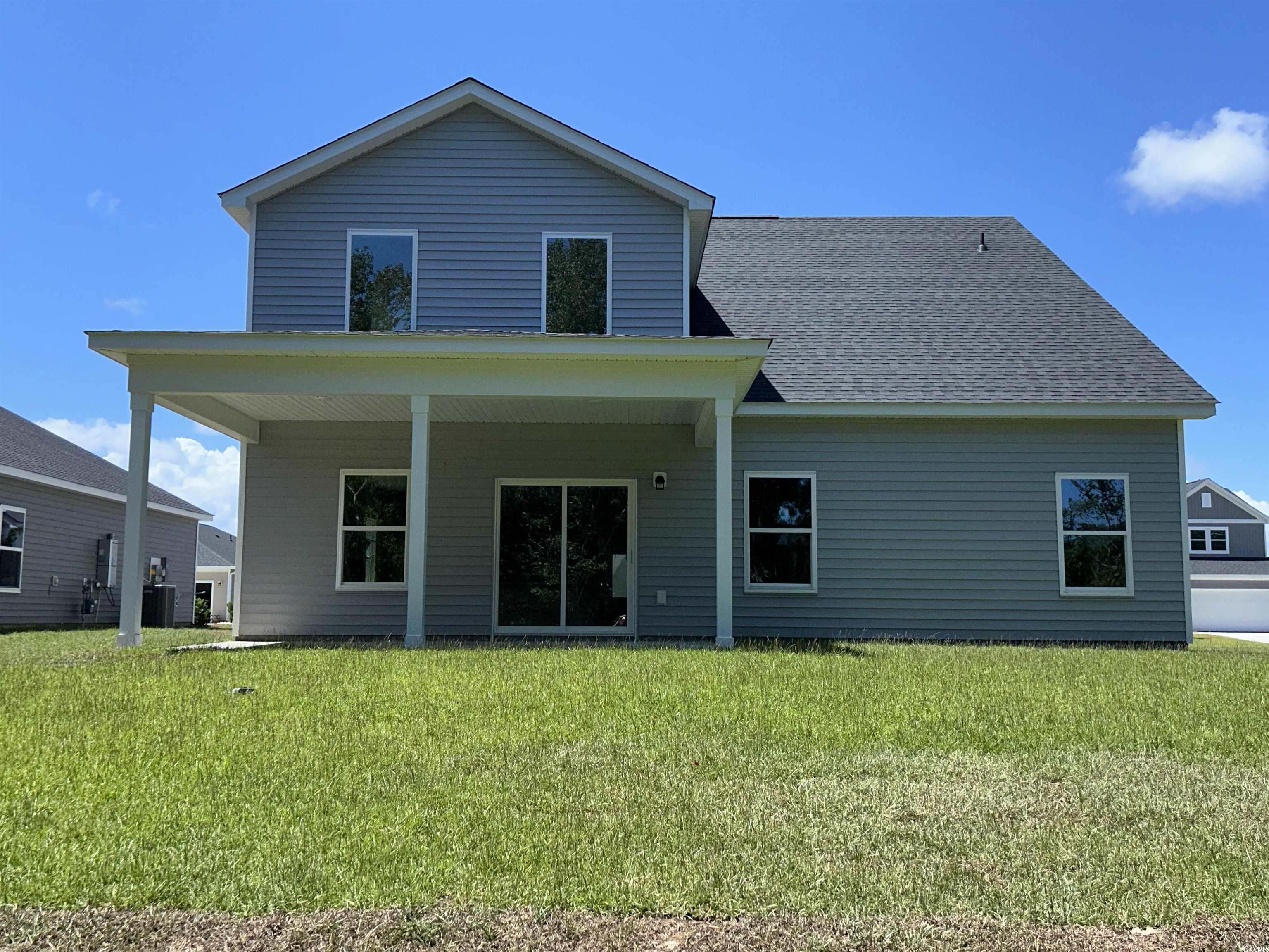 3068 Palma Way Myrtle Beach, SC 29579 - Photo 5 of 30 Back of house featuring a yard and a shingled roof