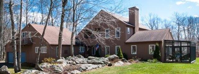 4411 Durham Road Guilford, CT 06437 - Photo 1 of 1 a front view of a house with garden