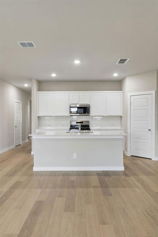1124 Del Rio Drive Lavon, TX 75166 - Photo 8 of 32 Kitchen in the Emmy II home plan by Trophy Signature Homes - REPRESENTATIVE PHOTO